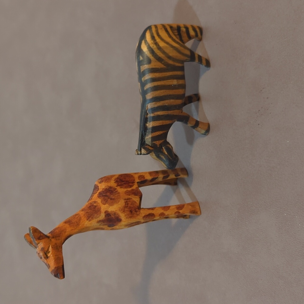 Small hand carved wooden zebra and giraffe hand painted